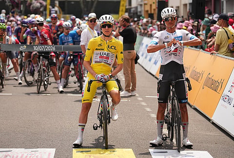 Slovenia's Tadej Pogacar, wearing the overall leader's yellow jersey, and Mexico's Isaac Del Toro, wearing the best young rider's white jersey, wait for the start of the seventh stage of the Tour de France cycling race over 175.1 kilometers (108.7 miles) with start in Hagetmau and finish in Bordeaux, France, Friday, July 10, 2026. 