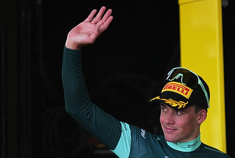 Denmark's Mads Pedersen, wearing the best sprinter's green jersey, celebrates on the podium after the seventh stage of the Tour de France cycling race with start in Hagetmau and finish in Bordeaux, France, Friday, July 10, 2026. 