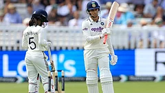 India's Smriti Mandhana acknowledges the crowd after reaching 50 runs during day one of the first Women's Rothesay Test between India and England at Lord's Cricket Ground in London, Friday, July 10, 2026. - AP Photo/Nigel French