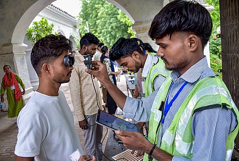 Aspirants undergo security check as they arrive to appear for LT Grade Assistant Teacher Mains Examination conducted by Uttar Pradesh Public Service Commission (UPPSC), in Prayagraj, Uttar Pradesh.