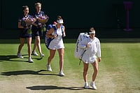 AP : Wimbledon 2026 Final Live Updates: Karolina Muchova of Czech Republic, right and Linda Noskova of Czech Republic walk on to Centre Court.