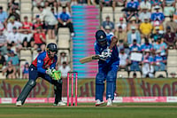 AP/Anthony Upton : Jos Buttler of England, left, and Sanju Samson of India during the international T20 Cricket match between England and India in Southampton