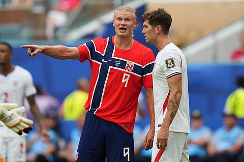 Norway's Erling Haaland, left, gestures next to England's John Stones during the World Cup quarterfinal soccer match in Miami Gardens, Fla., Saturday, July 11, 2026.