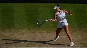 | Photo: AP/Maja Smiejkowska : Linda Noskova of Czech Republic hits a return to Marta Kostyuk of Ukraine during their women's singles semifinal match at the Wimbledon Tennis Championships in London.