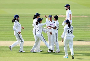 | Photo: Nigel French/PA via AP : India's Kranti Gaud (second right) celebrates with her team mates after taking the wicket of England's Tammy Beaumont, background right, during day one of the first Women's Rothesay Test between India and England at Lord's Cricket Ground in London, Friday, July 10, 2026.