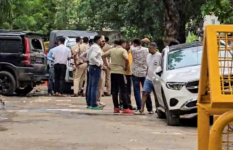Police personnel at the site following an encounter between Gurugram Police Crime Branch teams and suspected criminals in the Sushant Lok Phase-2 area, in Gurugram, Friday, July 10, 2026. As per officials, four suspected criminals were killed and one was injured in the encounter, while three police personnel also sustained gunshot injuries. - PTI