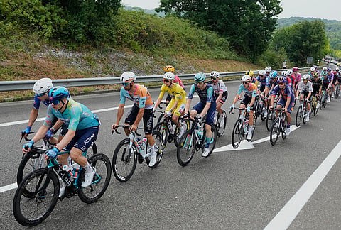 Slovenia's Tadej Pogacar, wearing the overall leader's yellow jersey, rides with the pack during the seventh stage of the Tour de France cycling race over 175.1 kilometers (108.7 miles) with start in Hagetmau and finish in Bordeaux, France, Friday, July 10, 2026. 