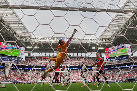 England goalkeeper Jordan Pickford (1) reaches for the ball as it hits the bar during the World Cup quarterfinal soccer match between Norway and England in Miami Gardens, Fla., Saturday, July 11, 2026.