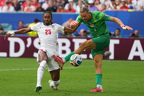 Norway goalkeeper Oerjan Nyland and England's Djed Spence vie for the ball during a World Cup quarterfinal soccer match in Miami Gardens, Fla., Saturday, July 11, 2026.