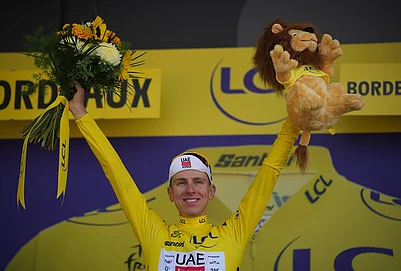 | Photo: AP/Mosaab Elshamy : Slovenias Tadej Pogacar, wearing the overall leaders yellow jersey celebrates on the podium after the seventh stage of the Tour de France cycling race with start in Hagetmau and finish in Bordeaux, France, Friday, July 10, 2026.