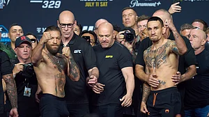 (AP Photo/John Locher) : Conor McGregor, left, and Max Holloway right pose during a ceremonial weigh-in for the UFC 329 mixed martial arts event Friday, July 10, 2026, in Las Vegas