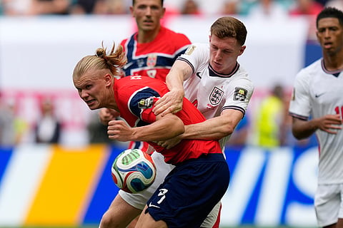 Norway's Erling Haaland, left, is fouled by England's Elliot Anderson during the World Cup quarterfinal soccer match between Norway and England in Miami Gardens, Fla., Saturday, July 11, 2026.