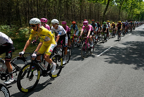 Slovenia's Tadej Pogacar, wearing the overall leader's yellow jersey, rides with the pack during the seventh stage of the Tour de France cycling race over 175.1 kilometers (108.7 miles) with start in Hagetmau and finish in Bordeaux, France, Friday, July 10, 2026. 