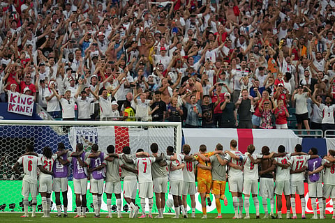 Players of England react after the World Cup quarterfinal soccer match against Norway in Miami Gardens, Fla., Saturday, July 11, 2026.