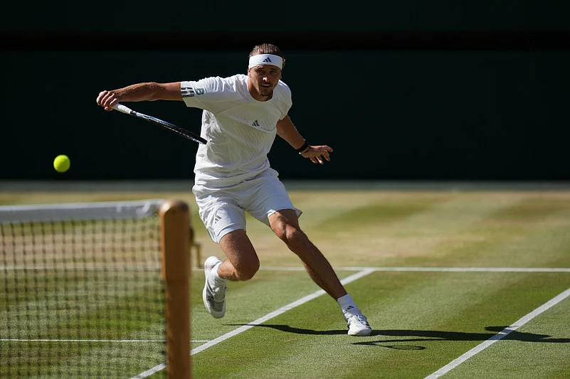 Alexander Zverev of Germany returns the ball to Jannik Sinner of Italy in the mens singles final at Wimbledon Tennis Championships in London