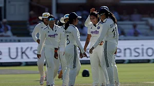 Steven Paston/AP Photo : Sayali Satghare celebrates with her teammates after bowling England's Alice Capsey during day three of the first Women's Test match at Lord's cricket ground.