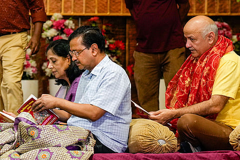 AAP National Convenor Arvind Kejriwal, with his wife Sunita Kejriwal and party leader Manish Sisodia, attends a 'Sundarkand Path', in New Delhi.