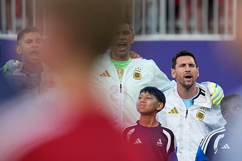 Argentina's Lionel Messi, right, sings his national anthem with teammates ahead of the World Cup quarterfinal soccer match between Argentina and Switzerland in Kansas City, Mo., Saturday, July 11, 2026