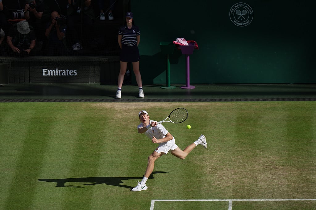 Jannik Sinner of Italy returns the ball to Alexander Zverev of Germany in the mens singles final at Wimbledon Tennis Championships in London
