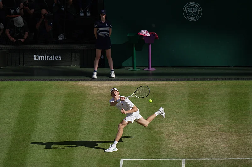Jannik Sinner of Italy returns the ball to Alexander Zverev of Germany in the mens singles final at Wimbledon Tennis Championships in London
