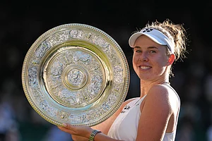 | Photo: AP/Kirsty Wigglesworth : Linda Noskova of Czech Republic poses with the trophy after winning against Karolina Muchova of Czech Republic in the women's singles final at Wimbledon Tennis Championships in London.