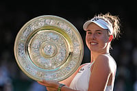 | Photo: AP/Kirsty Wigglesworth : Linda Noskova of Czech Republic poses with the trophy after winning against Karolina Muchova of Czech Republic in the women's singles final at Wimbledon Tennis Championships in London.