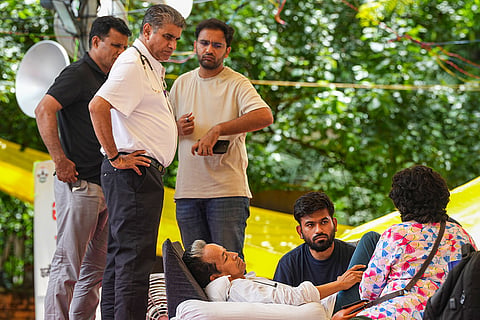 Climate activist Sonam Wangchuk being attended by a medical professional as Cockroach Janata Party (CJP) founder Abhijeet Dipke looks on during a hunger strike by CJP demanding action over alleged irregularities in examinations and seeking the resignation of Union Education Minister Dharmendra Pradhan, at Jantar Mantar, in New Delhi. Wangchuk is on the 15th day of his indefinite hunger strike.
