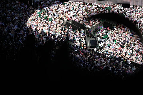 Spectators watch the men's singles final between Jannik Sinner of Italy and Alexander Zverev of Germany at Wimbledon Tennis Championships in London