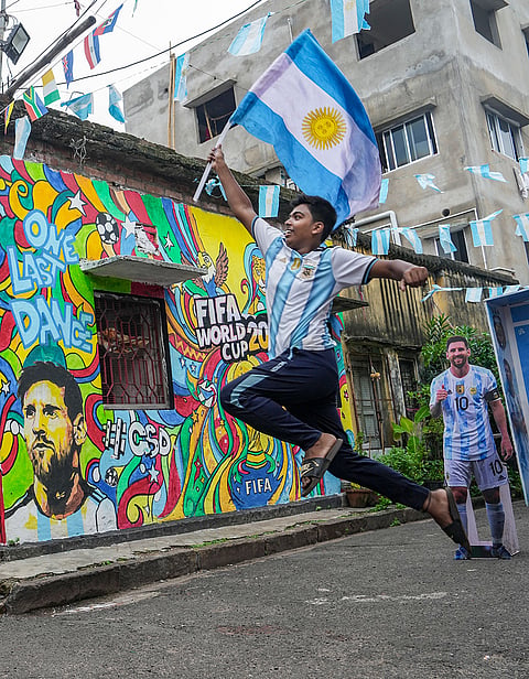 Argentina fans celebrate after their team secured a place in the FIFA World Cup 2026 semifinals, in Kolkata, West Bengal.