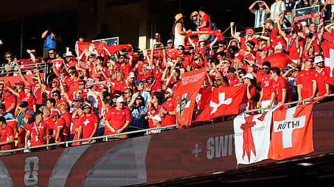 Switzerland fans react ahead of the World Cup quarterfinal soccer match between Argentina and Switzerland in Kansas City, Mo., Saturday, July 11, 2026