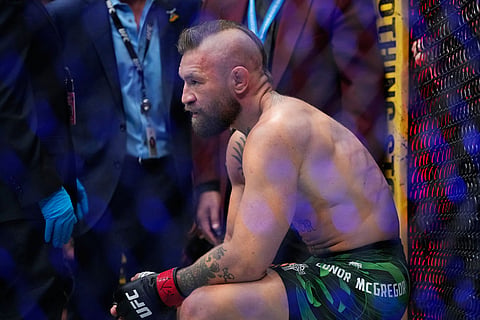 Conor McGregor reacts after losing to Max Holloway in a welterweight fight at the UFC 329 mixed martial arts event in Las Vegas.