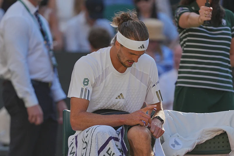 Alexander Zverev of Germany injects himself with insulin during a changeover in the mens singles final match against Jannik Sinner of Italy, at Wimbledon Tennis Championships in London