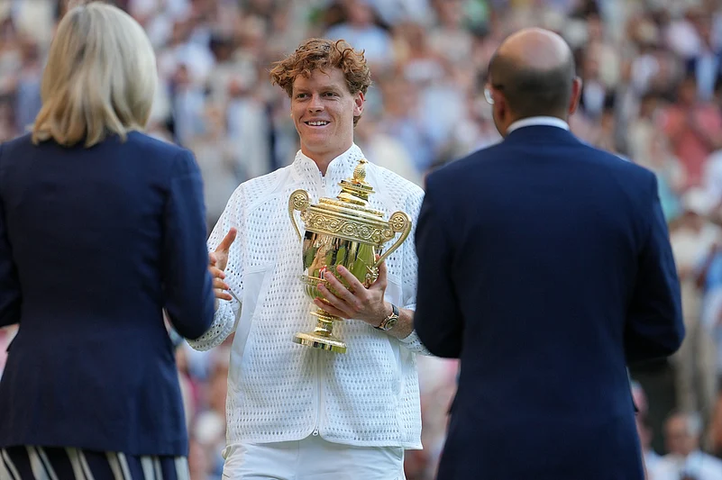 Jannik Sinner of Italy hold the winner trophy after defeating Alexander Zverev of Germany in the mens singles final at Wimbledon Tennis Championships in London