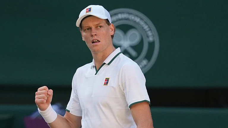 Jannik Sinner of Italy celebrates winning the second set against Alexander Zverev of Germany in the men's singles final at Wimbledon Tennis Championships in London. - Kirsty Wigglesworth/AP Photo