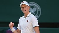 Kirsty Wigglesworth/AP Photo : Jannik Sinner of Italy celebrates winning the second set against Alexander Zverev of Germany in the men's singles final at Wimbledon Tennis Championships in London.