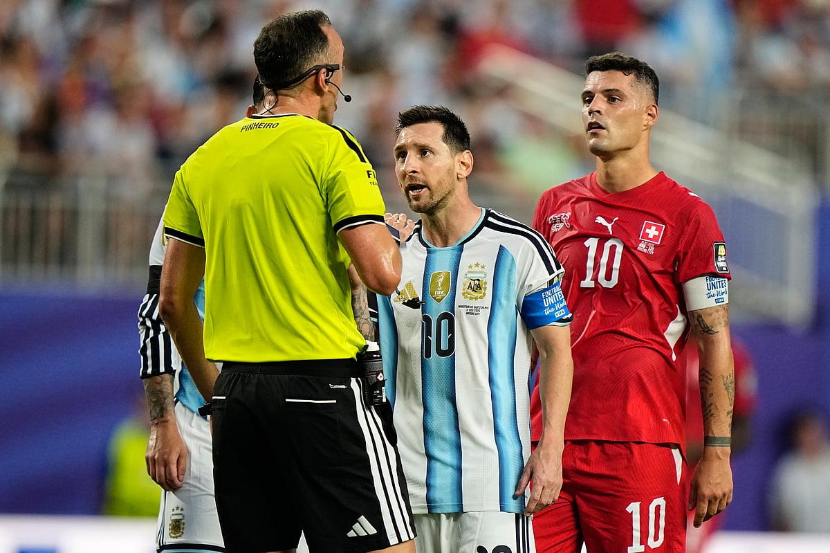FIFA World Cup 2026, Argentina vs Switzerland Live Score Today: Argentina's Lionel Messi (10), talks to referee Joao Pinheiro, left, of Portugal, during the World Cup quarterfinal soccer match - AP