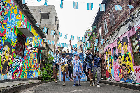Argentina fans celebrate after their team secured a place in the FIFA World Cup 2026 semifinals, in Kolkata, West Bengal.