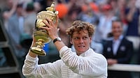 Kirsty Wigglesworth/AP Photo : Jannik Sinner of Italy celebrates with his trophy after winning against Alexander Zverev of Germany in the men's singles final at Wimbledon Tennis Championships in London.