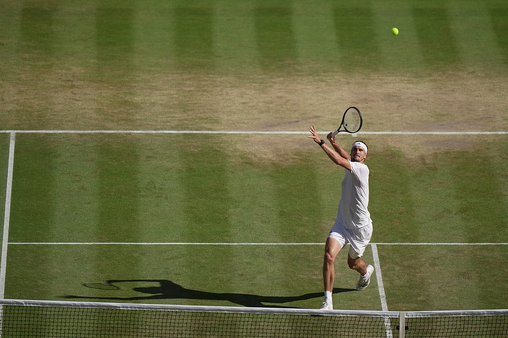 Alexander Zverev of Germany returns the ball to Jannik Sinner of Italy in the mens singles final at Wimbledon Tennis Championships in London