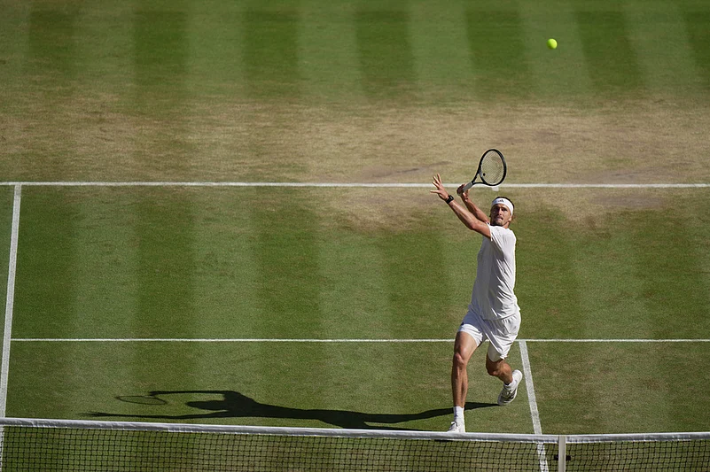 Alexander Zverev of Germany returns the ball to Jannik Sinner of Italy in the mens singles final at Wimbledon Tennis Championships in London