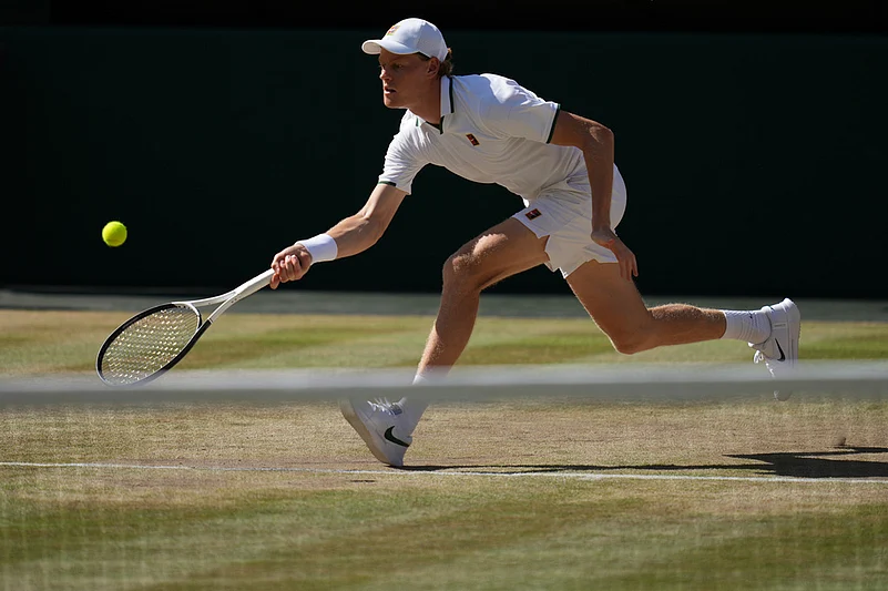 Jannik Sinner of Italy returns the ball to Alexander Zverev of Germany in the mens singles final at Wimbledon Tennis Championships in London