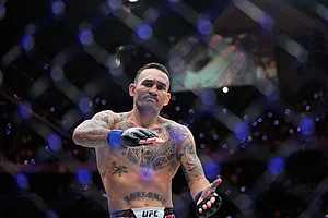 | Photo: AP/John Locher : Max Holloway reacts after he won against Conor McGregor in a welterweight fight at the UFC 329 mixed martial arts event in Las Vegas.