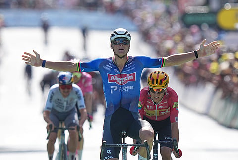 Netherland's Mathieu van der Poel celebrates as he crosses the finish line to win the ninth stage of the Tour de France cycling race with start in Malemort and finish in Ussel, France, Sunday, July 12, 2026. 