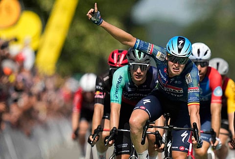 Belgium's Tim Merlier celebrates as he crosses the finish line to win the eighth stage of the Tour de France cycling race with start in Perigueux and finish in Bergerac, France, Saturday, July 11, 2026.
