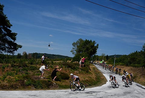 The pack rides during the ninth stage of the Tour de France cycling race with start in Malemort and finish in Ussel, France, Sunday, July 12, 2026.
