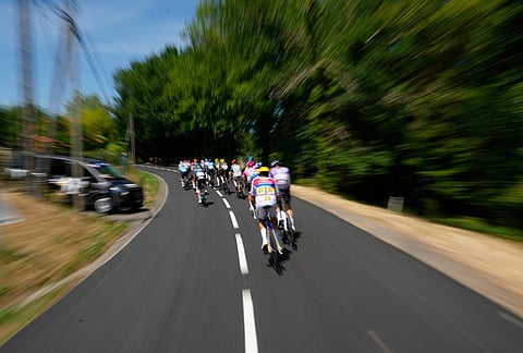 The pack rides during the ninth stage of the Tour de France cycling race with start in Malemort and finish in Ussel, France, Sunday, July 12, 2026.