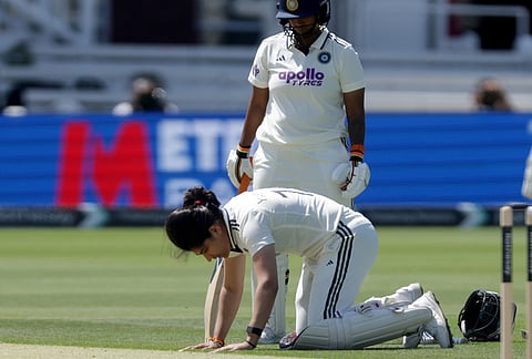 India's Yastika Bhatia kisses the wicket as she celebrates reaching her hundred during day three of the first Women's Test match at Lord's cricket ground in London, Sunday July 12, 2026. 