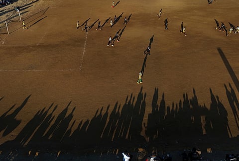 Players compete during a soccer match organized by South African player Relebohile Mofokeng Foundation, in Sharpeville, South Africa.