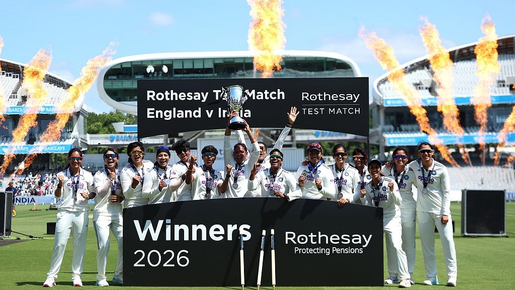India players celebrate with the trophy following the victory in the test match during day four of the first Women's Rothesay Test cricket match between England and India in London, England, Monday, July 13, 2026.  - AP Photo/Steven Paston