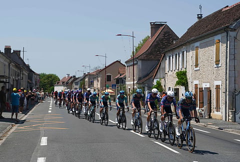 The pack rides during the eighth stage of the Tour de France cycling race over 180.4 kilometers (111.8 miles) with start in Perigueux and finish in Bergerac, France, Saturday, July 11, 2026.